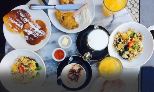 A table full of breakfasts as might be found on a lovely morning in St. Augustine.