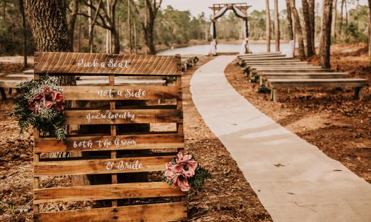 For this wedding at the Florida Agricultural Museum, guests are invited to sit on either side as they create a new family.