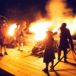 In the dark of night, reenactors at Matanzas Nat'l Monument light cannons that light up in a burst of fire.