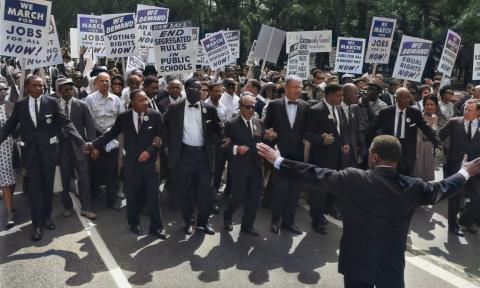 A group of African American men rally at a civil rights protest. 