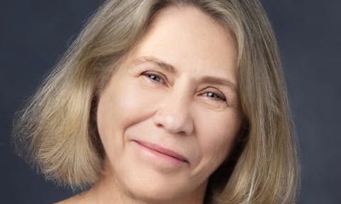 Trish MacEnulty, author, in a full-head shot against a gray background.