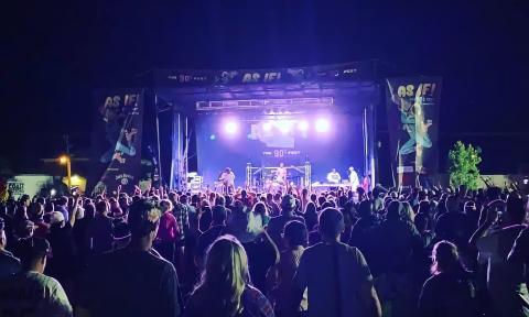 Looking over the crowd to the stage at the 2022 As If! Fest at night
