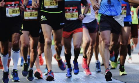 Participants race quickly over asphalt. 