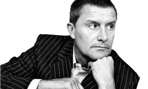 Carl Palmer poses in a pinstripe suit. 