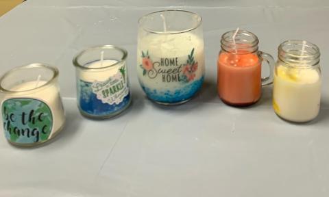 A group of hand-made candles presented by a young vendor at Kidz Entrepreneur event