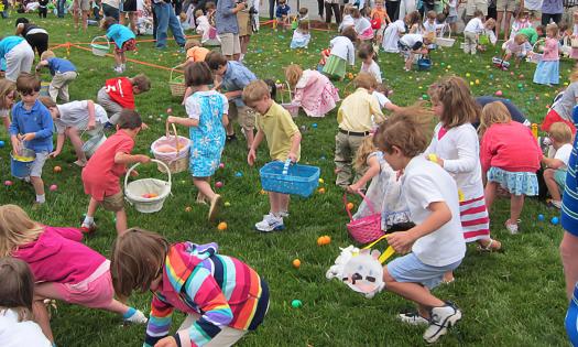 Kids playing and searching during an Easter egg hunt