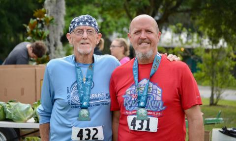 Runners posing with finisher medals for Hastings' Spud Run