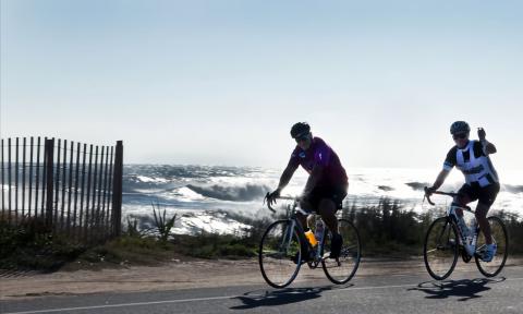 Cyclists riding along historic A1A with views of the Atlantic