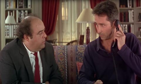 A still image from the film, "Le Diner de Cons"