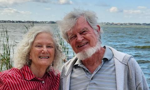 Two of the Tale Tellers of St. Augustine, standing near the water