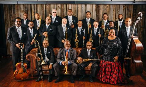 The 2024 Count Basie Orchestra, standing and seated with their instruments