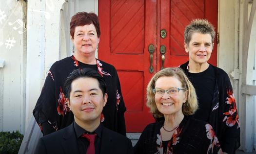 The four members of the Florida Chamber Music Project, in black and red in front of a red door