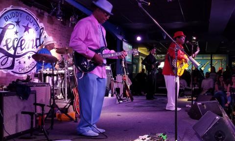 Biscuit Miller performs on stage for audiences. 