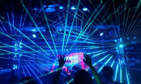 Partygoers dance at a rave.