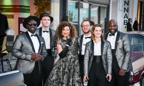 Singer Svetlana with her band, the New York Collective, in black tie outside