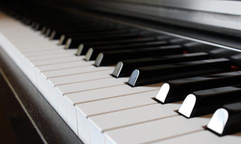 The keys of a piano stretch from upper left to lower right