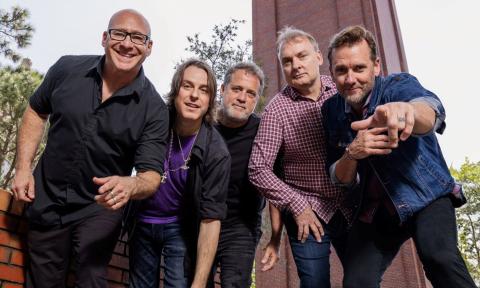 Bandmates from Sister Hazel pose outdoors. 