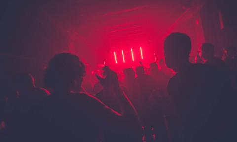 Partygoers lose themselves in the rhythm at a rave.