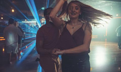 Partners twirling while salsa dancing