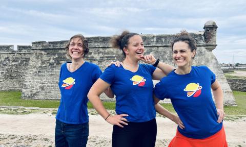 three women in front of the fort