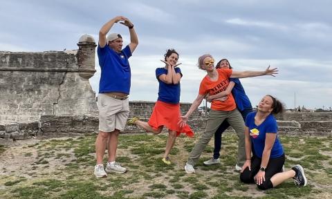 Improv comedians in front of the fort