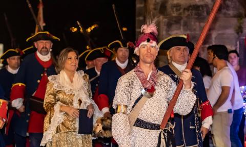 Members of the garrision marching through the City Gate during Colonial Night Watch