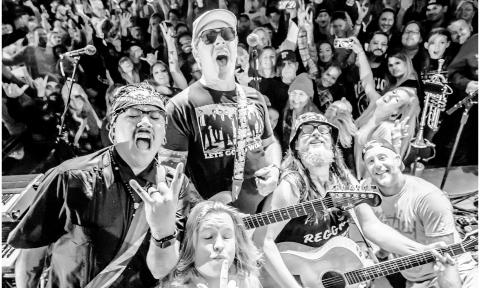 Members if Badfish—A Sublime Tribute gathered on stage with the audience behind them