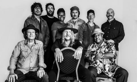 Devon Allman poses with Jimmy Hall and other artists from the Blues Summit. 