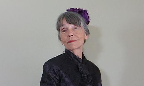 Storyteller and actor Margaret Kaler in historic garb