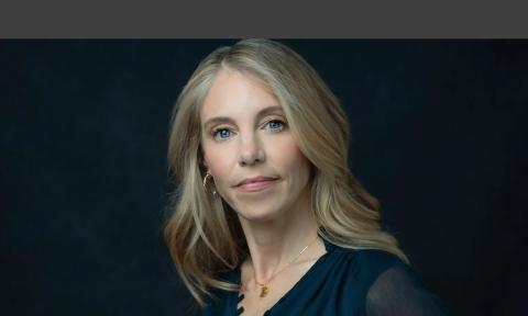 Journalist Molly Knight Raskin against a dark background