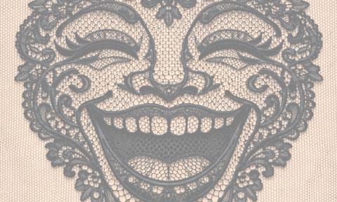 a woman's face made out of lace that's laughing