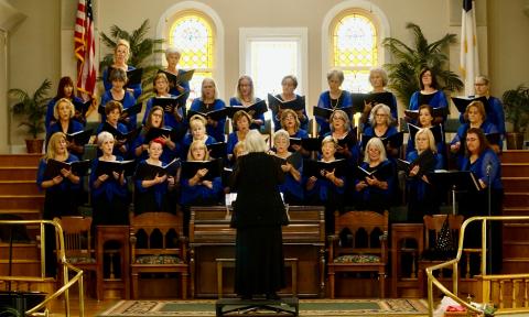 North Florida Women's Chorale with blue tops