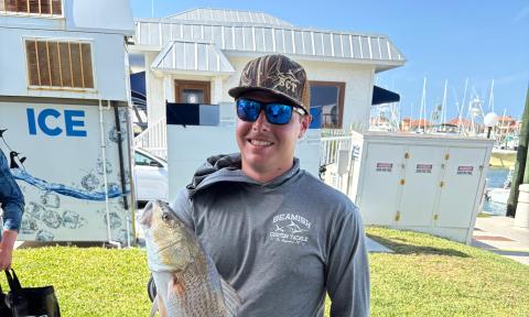 An angler with a large fish caught at the SAHS inshore fishing tournament