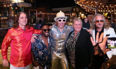 Bandmates from Billy and the Jets pose with fans.