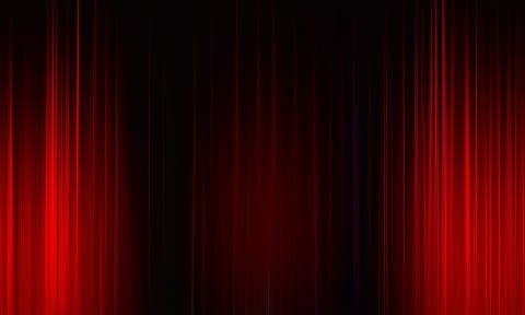 Red curtain on a black stage