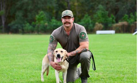 A St. Johns Sherriff K9 Unit posing on a lawn