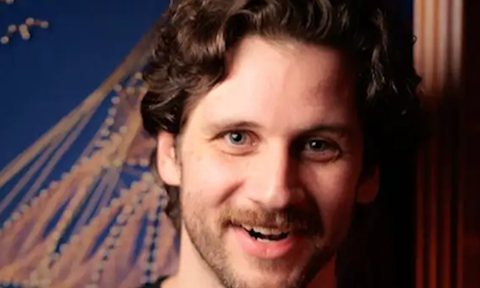 Tim Butterly smiles and poses for fans.