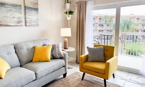 The patio doors offer a view and bring sunshine into the condo