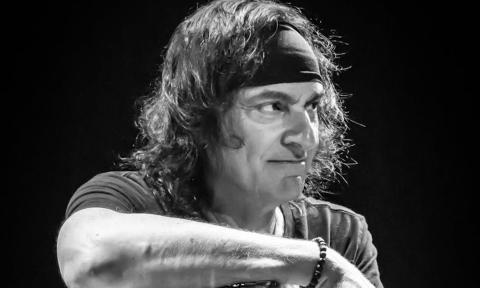 Vinny Appice poses in a black-and-white photograph for fans.
