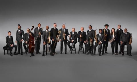 The members of the Jazz at Lincoln Center Orchestra lined up with their instruments, with Wynton Marsalis in the center