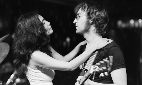 John Lennon and Yoko Ono playing live music