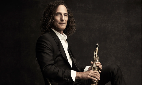 Kenny G poses with his saxophone.