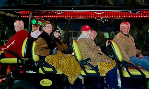 Guests taking a Nights of LIghts Tour on a cool night