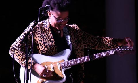 Amythyst Kiah performing on stage.