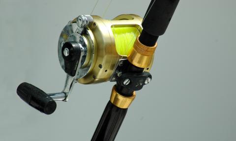 A fishing rod and real ready for saltwater fishing.