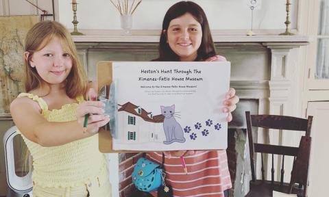Two girls exploring the Ximenez-Fatio House Museum during Fatio Fun Day in St. Augustine.