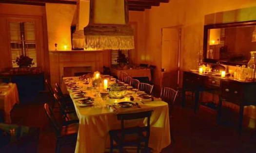 The dining room at the Ximenez-Fatio House — lit by candles at night. 