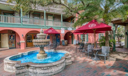 The Courtyard at the St. George Inn, featuring a fountain and seating area in St. Augustine.