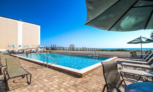Visitors can relax and enjoy the view of the beach from the heated pool at Beacher's Lodge.
