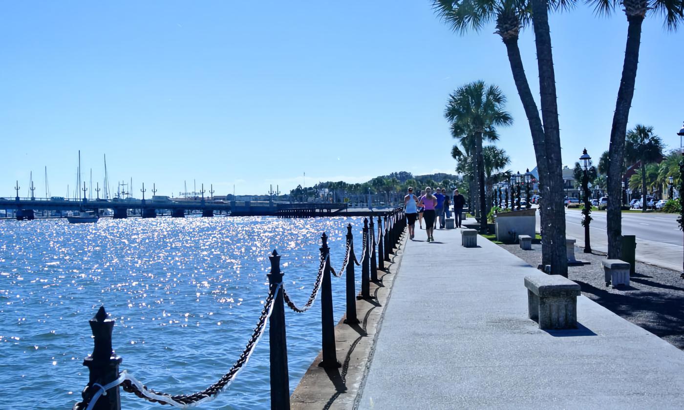 People walking along the Bayfront and enjoying the view on a beautiful day in St. Augustine.